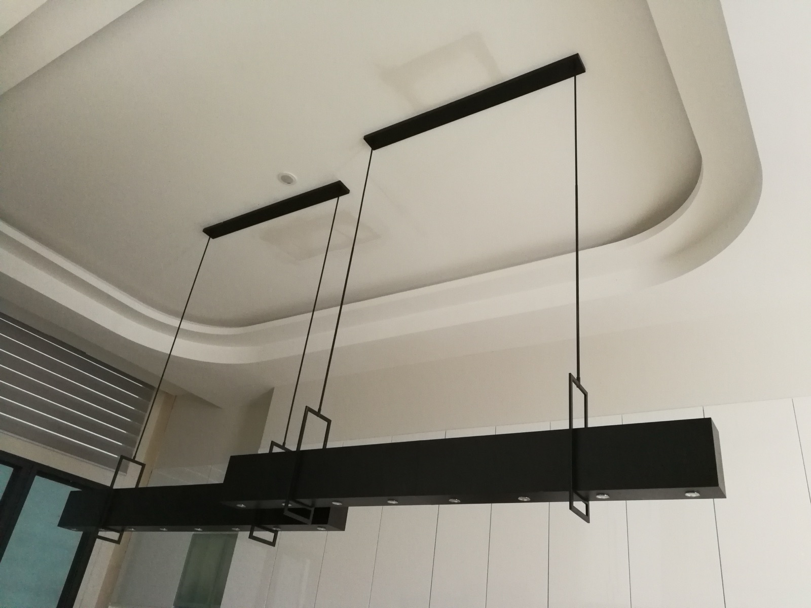 Linear black pendants — lit